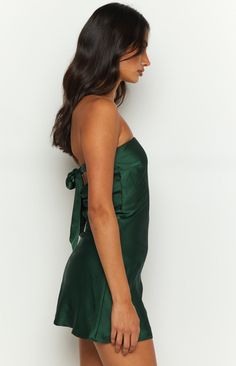 * Green Mini Dress 
 * 
 
 * HOW TO STYLE: 
 * We cannot take out eyes off this chic strapless mini dress ()! This style and colour is perfect for your formal or homecoming () event. Elevate with heels and gold jewellery ()! 
 * 
 
 * FEATURES: 
 * Lightweight 
 * Mini length 
 * Bias cut 
 * Slight stretch 
 * Invisible zip on left side 
 * Ribbon tie-up back 
 * Low detailing at back  
 * Lined Semi Formal Dress Green, Emerald Dress Formal Mini, Mini Dresses For Homecoming, Homecoming Emerald Dress Mini, Silk Emerald Green Dress Short, Emerald Green Dress Formal Mini, Gala Mini Dress, Formal Mini Dress Unique, Green Formal Mini Dress