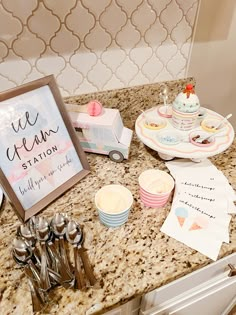 a kitchen counter topped with plates and cups next to a sign that says we clean station