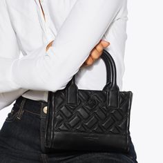 Quilted Leather Evening Bag, Designer Quilted Top Handle Bag, Designer Quilted Satchel Shoulder Bag, Quilted Leather Bag With Double Handle, Designer Quilted Bag With Double Handle, Designer Quilted Rectangular Shoulder Bag, Quilted Top Handle Shoulder Bag For Shopping, Designer Black Quilted Shoulder Bag, Formal Quilted Leather Bag