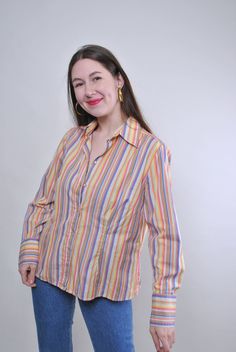 Vintage striped multicolour blouse with long sleeve, Size L Welcome to TARASCOMMON.ETSY.COM Unique clothing from the 20th century.   Model tall - 170cm   L. 44 - size on the tag.   Sleeve - 45cm / 17.71inch; ( armpit to end of sleeve); Width - 50cm / 19.68inch; Length - 65cm / 25.59inch.    All measurements are taken seam to seam while lying flat.   This item is vintage, so it can have some defects. Additional photos can be send   We are glad that you are interested in lots that we sell. Wish yo Casual Multicolor Tops With Striped Collar, Summer Long Sleeve Blouse With Vertical Stripes, Long Sleeve Blouse With Vertical Stripes For Summer, Multicolor Long Sleeve Workwear Shirt, Multicolor Long Sleeve Shirt For Work, Casual Long Sleeve Blouse With Striped Collar, Multicolor Long Sleeve Relaxed Fit Blouse, Multicolor Cotton Top With Striped Collar, Spring Long Sleeve Shirt With Striped Collar