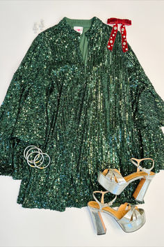 Look stunning in our sequin Gayle Dress. Featuring a deep V-neck and bell sleeves this dress is designed to flatter your figure and make you feel your best. Plus, you can secure it with 3 buttons up the front for a secure fit that still looks great. Green V-neck Sequin Evening Dress, Chic Holiday Sequin Dress With V-neck, Chic V-neck Sequin Dress For Holiday, Festive V-neck Dress For Party Season, V-neck Dress For Festive Party Season, Fall Sequin V-neck Dress For Night Out, Party-ready V-neck Sequin Dress, Holiday Sequin V-neck Dress For Date Night, Sequined V-neck Dress For Christmas