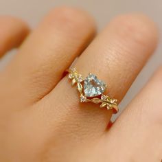 Cue the romance with our stunning Heart’s Desire Aquamarine Ring. This perfect expression of true love features a heart-shaped aquamarine center stone along with a curved white topaz leafy band that adds a natural charm. A cherished keepsake that radiates love from every angle. ✦ Available in both 14K yellow gold vermeil (14K yellow gold plated over a sterling silver base) and 10K solid yellow gold. Aquamarine Heart Ring, Engament Rings, Heart Solitaire Ring, Heart Cut Ring, Heart Wedding Rings, Heart Promise Rings, Cute Engagement Rings, Gold Promise Rings, Gift For The Bride