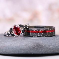 Celebrate your unique love with our stunning Red Garnet Couples Ring Set, featuring matching his and hers wedding bands designed to complement each other beautifully. The men's ring is crafted from ruggedly handsome black tungsten carbide, showcasing a rustic brushed hammered finish that exudes strength and timeless style. The women's ring, made from elegant n925 sterling silver, offers a sophisticated contrast with its sleek, polished appearance. Each band is adorned with a captivating red garn Masculine Aesthetic, His And Hers Wedding Bands, Couples Ring, Couples Ring Set, Hammered Ring, Black Tungsten, Hammered Rings, Book Aesthetics, Matching Wedding Bands