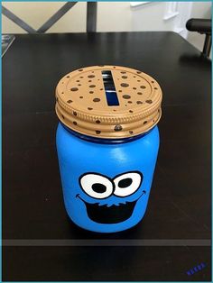 a cookie jar with a cookie face painted on it