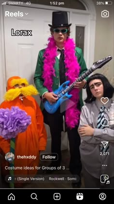 three people dressed up in costumes and holding guitars