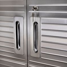 two stainless steel doors with handles on them