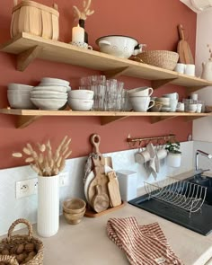 a kitchen counter with dishes and utensils on it