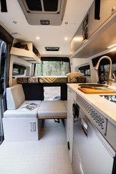 the interior of a camper van is clean and ready for people to use it