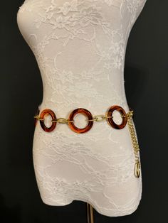 Quality Tortoishell ring belt with Gold Chain.  This fashionable belt is perfect for dresses, swimwear, resort wear, gifts.  Exclusively designed by FAN Design, FAN Fashion Hand made in a range of sizes.  Teen sizes though to waist size 60". For larger belts send me a convo.  Perfect wardrobe accessory or gifts. Gold Chain Belt For Beach, Elegant Chain Jewelry For Vacation, Elegant Vacation Jewelry With Chain Detail, Elegant Vacation Jewelry Chain, Elegant Adjustable Chain Belt For Summer, Brown Jewelry For Beach, Gold Waist Chain, Ring Belt, Fan Fashion