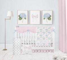 a baby's room with blue and pink decor