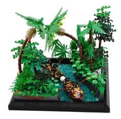 a lego model of a boat in the water surrounded by trees and plants with people on it