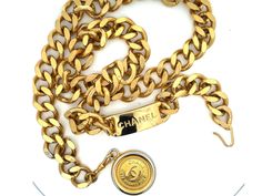 Classic and chic, this vintage Chanel chain belt is crafted in gold-plated metal, accented with a 'CC' logo-engraved medallion pendant. Closure can be hooked on multiple links for a variety of fits.Brooch Specifications:Designer: CHANELFits Waist Size Up To: 31"Coin Measurements: ~1.25" Stamped: "CHANEL "Made in France"Condition: PreownedGold Plated Chanel Chain Belt, Chanel Chain, Vintage Medallion, Chanel Vintage, Chain Belt, Cc Logo, Vintage Chanel, Waist Size, Made In France