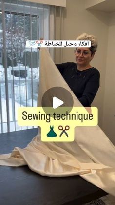 a woman is sewing fabric on a table in front of a window with the words sewing technique written above it