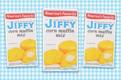 three packages of corn muffins on a blue and white checkered tablecloth