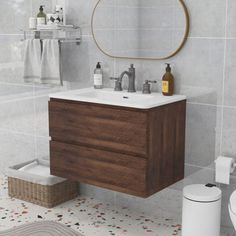 a bathroom with a sink, toilet and mirror in it's center area is shown