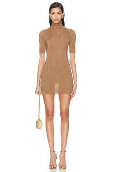 Find ZEYNEP ARÇAY Glitter Tube Mini Dress In Metallic Gold on Editorialist. Zeynep Arcay Glitter Tube Mini Dress in Metallic Gold 78% cellulose acetate 12% metallized polyester 10% nylon. Made in Turkey. Dry clean only. Unlined. Pull-on styling. Turtleneck styling. Ribbed knit fabric with metallic threading. Garment is made with a semi-sheer fabric, undergarments can show through. ZEYF-WD118. PF24DR02. About the designer: Debuting a new age of elegance to the irresistible appeal of leather, Zeynep Arcay offers sophisticated and modern designs with a touch of timeless elegance to her collection. Confident in the belief that leather is an essential part of modern identity, her styles can be easily worn from early days in the office extending to stylish invitations in the evening. Evening Fitted Lurex Mini Dress, Fitted Glitter Mini Dress For Evening, Fitted Chic Sequin Dress With Shimmer Details, Chic Fitted Metallic Sequin Dress, Chic Fitted Sequin Dress With Shimmer, Fitted Shimmer Mini Dress For Holiday Party, Elegant Evening Mini Dress In Lurex, Metallic Fitted Lurex Dress, Fitted Metallic Lurex Dress