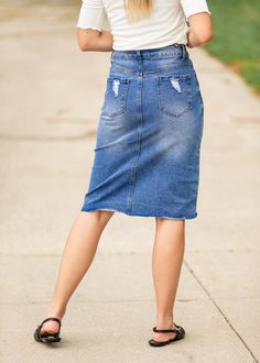 The Tiana Distressed Denim Midi Skirt is a modest and cute denim midi skirt! Designed with backed distressing at the front and back pockets, an uneven raw hem, 5 pockets for holding all the things, and a classic button zipper closure. Style: distressed, denim, midi length Color: Denim Quality control is of the utmost importance to us. Our sizing is always approximate and can also depend heavily on your own body shape. Just like no two people are the same, the same goes for skirts, dresses + tops Trendy Medium Wash Skirt With Frayed Hem, Dark Wash Cutoff Denim Skirt With Frayed Hem, Cutoff Dark Wash Denim Skirt With Frayed Hem, Ripped Denim Skirt In Medium Wash, Ripped Medium Wash Denim Skirt, Mid-rise Dark Wash Denim Skirt With Frayed Hem, Mid-rise Ripped Denim Skirt, Distressed Denim Skirt In Medium Wash, Ripped Medium Wash Cotton Denim Skirt