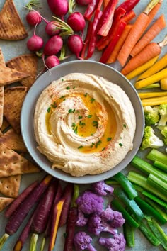 hummus with carrots, celery, radishes and other vegetables