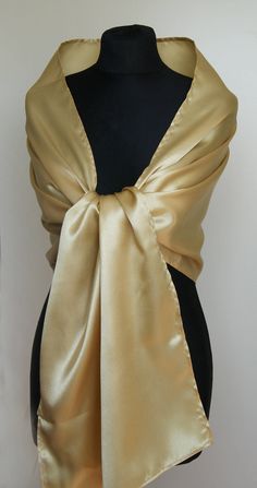 A very elegant satin shawl for your wedding party or evening dress. Made of luxury satin, slightly sparkles on the sun or light. Color: gold ( other colors are available ) Size : 170 cm x 45 cm You can use it as a wrap, shawl or stola. WE have matching satin bags in Etsy Shop! WE accept credit cards! Luxury Gold Shawl For Wedding, Gold Fitted Shawl For Party, Fitted Gold Shawl For Party, Cream Shawl For Evening, Classic Gold Silk Scarf, Elegant Cream Shawl For Evening, Elegant Gold Silk Scarf For Evening, Elegant Gold Silk Scarf, Elegant Gold Pashmina Shawl