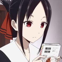 an anime character holding a box with food in it