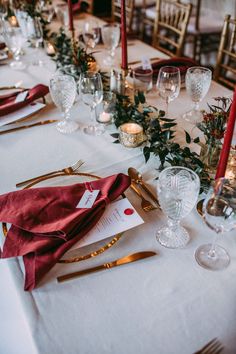 the table is set with candles and place settings