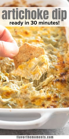 a hand dipping a tortilla chip into a casserole dish with text overlay that reads, artichoke dip ready in 30 minutes