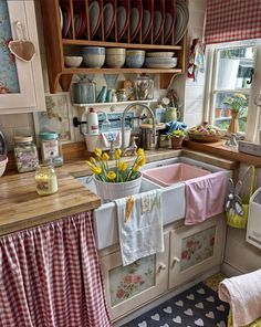 the kitchen is clean and ready to be used as a place for tea or coffee