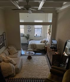 a living room filled with furniture and a flat screen tv