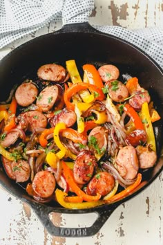 sausage, peppers and onions in a skillet