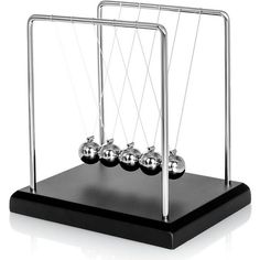 an abacusk with four balls in it on a black stand and white background