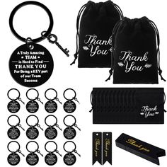 a set of black key chains and bags with thank you tags on the front, along with other items