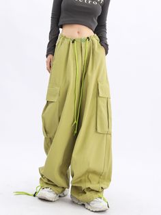 Make a statement with our Acubi Wide Leg Baggy Cargo Pants. These Y2K streetwear essentials boast a relaxed fit, drawstring waist, and plenty of pockets, offering a perfect fusion of style and urban fashion. Acubi Aesthetic, Baggy Track Pants, Parachute Cargo Pants, Parachute Cargo, Wide Leg Cargo Pants, Camo Jeans, Streetwear Essentials, Baggy Cargo Pants, Blue Vests