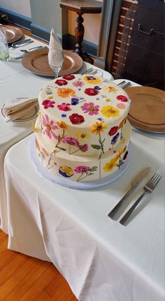 a cake sitting on top of a white table