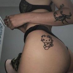 a woman with tattoos on her stomach