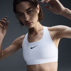 You're on the move. Your padding shouldn't be. This Swoosh bra's sewn-in pads stay in place so you can work hard without worrying about them shifting or folding. Great for training workouts and dance classes, medium support gives you a snug hold that helps keep everything in place. Plus, sweat-wicking, adaptive material quickly recovers its shape so you can stay comfortable throughout your workout. Bra Sewing, Training Workouts, Dance Classes, White Sports Bra, Nike Sports Bra, Padded Sports Bra, Women Lifestyle, Nike Sports, Nike Swoosh