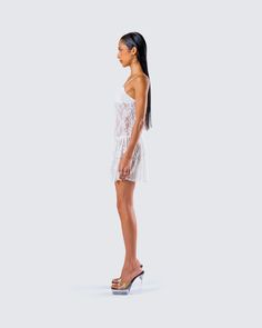 Give em' a taste of heaven in this white lace pleated dress 🤍 Made from stretchy lace, and complete with a lined bandeau bra, pleated skirt, fitted bodice, and drop waist that creates an elegant, and flowy look ✨ Leave little to the imagination -- dress is sheer & undergarments are not included 👀 Fitted Lace Dress With Spaghetti Straps For Summer, Sheer Lace Dress With Spaghetti Straps For Night Out, Flirty Lace Mini Dress With Lace Bodice, Summer Night Out Dress With Delicate Lace, Strapless Fitted Lace Dress, Strapless Lace Summer Dress, Strapless Lace Dress For Summer, Fitted Strapless Lace Dress, Spaghetti Straps Mini Dress With Lace Back