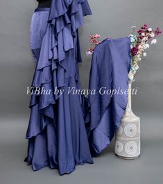 Transform yourself into a vision of elegance with our Ultra Violet Pre Plated Saree. Featuring ruffles and an embroidered blouse, this stylish saree is easy to drape, making it perfect for cocktail parties and other special occasions. Say goodbye to the hassle of draping with this one-minute saree. Elevate your look with this luxurious and exclusive piece.. Bollywood Style Ruffled Dress For Party, Bollywood Style Ruffled Party Dress, Bollywood Party Dress With Ruffles, Evening Blouse Piece With Ruffles For Diwali, Diwali Evening Blouse Piece With Ruffles, Evening Diwali Blouse Piece With Ruffles, Diwali Evening Ruffled Blouse Piece, Festive Floor-length Blouse Piece With Ruffles, Evening Ruffled Blouse Piece For Diwali