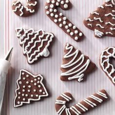 decorated cookies are arranged on a white tray