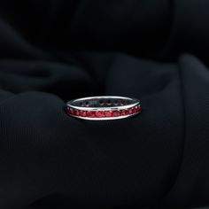 Product Details Fall in love with the beauty of this Created Ruby Eternity Ring. The ring features round cut created ruby in a stunning channel setting, creating a captivating effect. The ring is crafted in solid gold, providing durability and luxury. The full eternity band design makes it an elegant piece of jewelry that she will love to wear every day. Product Information SKU SHP-RINGS0821225550 Width 1.8 mm Height 3.5 mm Weight 2.48 gm (Approximate) LAB CREATED RUBY INFORMATION No.of Stones 2 Ruby Eternity Ring, Channel Setting, Band Design, Full Eternity Ring, Signature Jewelry, Timeless Jewelry, Ring Sizer, Ruby Gemstone, Eternity Band