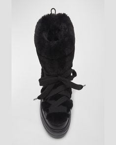 Moncler "Insolux" leather snow boots with faux fur (polyester) trim    2.36 in / 60 mm flat heel    Round toe    Laceup vamp    Rubber outsole    Lining: Polyester    Dry clean    Made in Italy Luxury Winter Boots With Faux Fur Trim, Fur Snow Boots, Leather Snow Boots, Italian Luxury, Snow Boots, Black Boots, Neiman Marcus, Faux Fur, Tops Designs