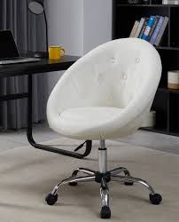 a white office chair sitting in front of a desk with a laptop computer on it