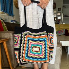 This colorful and stylish crochet boho bag is the perfect accessory for any fashion-forward individual who loves unique and handmade items. It's versatile and functional, serving as both a shoulder bag and a tote bag to accommodate all your belongings.  This colorful bag features intricate granny square patterns, carefully crocheted by hand using high-quality materials. Make a bold statement with this one-of-a-kind crochet handbag, and show off your love for bohemian-inspired fashion. Measuremen Bohemian Crochet Bag With Large Capacity And Double Handle, Bohemian Crochet Bag With Double Handle And Large Capacity, Large Capacity Bohemian Crochet Bag With Double Handle, Large Bohemian Beach Bag, Large Capacity Bohemian Crochet Bag, Bohemian Large Capacity Hobo Bag For Shopping, Multicolor Double Handle Crochet Bag With Large Capacity, Bohemian Crochet Tote Bag With Large Capacity, Multicolor Large Capacity Crochet Bag For Daily Use