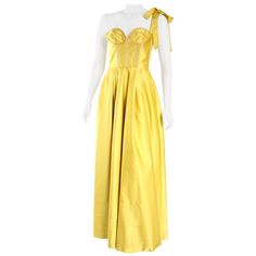 Rochas rich yellow gown in satin fabric with tie shoulder and structured bodice. Reminiscent of Belle's gown from Beauty and the Beast. Size IT 40/ US 4. Silk Gala Gown With Lined Bodice, Silk Gown With Lined Bodice For Gala, Silk Evening Gown With Boned Bodice, Silk Ball Gown Evening Dress With Boned Bodice, Silk Gala Gown With Boned Bodice, Silk Gown With Boned Bodice For Evening, Silk Gown With Boned Bodice For Gala, Fitted Yellow Satin Evening Dress, Yellow Satin Party Gown