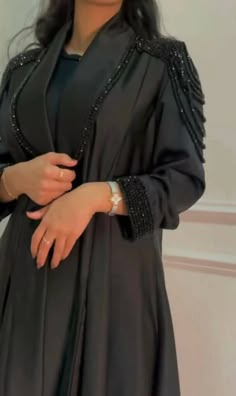 A gorgeous kimono style abaya perfect for the summer months, Ramadan, Eid, or any special occasions. Styling details include hand stitched diamonds and crystals on premium Nida fabric around the sleeves and on the lower sides of the abaya. Discreet snap fastener buttons inside the sleeve for added comfort. You are bound to receive compliments with this elegant piece. No refunds No exchanges final sale pricesCustomised productplease note that the Abaya may at times, have minimal & slight imperfec Work Abaya, Abaya Design, Mode Kimono, Mode Abaya, Abaya Designs, Streetwear Shop, Abaya Dress, Kimono Style, Abayas Fashion