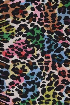 an animal print fabric with multicolored spots on the side and black, green, pink