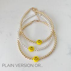 Something to smile about! This adorable smiley face bracelet comes in two versions: plain, or adorned with Swarovski crystals and pearls. In the second version the Swarovski crystals are clear, choose your pearl color: Classic White, Black Mist, Baby Blue, Metallic Blue, Olive Green, Lilac, Cranberry, Rose Gold, Light Pink, or Hot Pink. Also choose your finish from 3 options: sterling silver, gold filled, or rose gold filled. One inch of extra chain lets you adjust the bracelet to your preferenc Cheap White Smiley Face Bracelets, Smiley Face Round Beads Bracelet For Gift, Everyday Pink Smiley Face Bracelets, Casual Adjustable Smiley Face Bracelet, Adjustable Pink Jewelry With Smiley Face, Swarovski Crystal Bracelet, Metallic Blue, Swarovski Pearls, Pearl Color