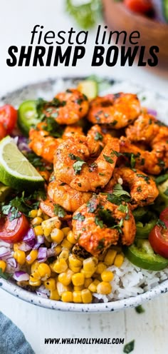 a bowl filled with shrimp and vegetables on top of rice