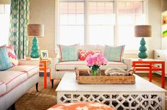 a living room filled with furniture and pillows