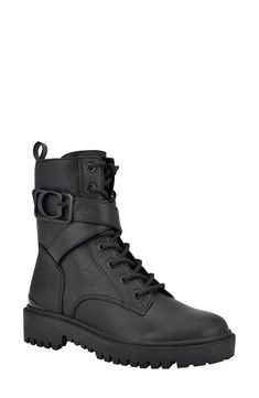 A signature logo buckle marks the shaft of this sturdy combat-style boot lifted on a lugged sole and finished with a side-zip entry. 1 1/4" heel 6 1/4" shaft Synthetic upper and lining/rubber sole Imported Black Impact-resistant Combat Boots For Hiking, Abrasion-resistant Black Combat Boots For Outdoor, Black Lace-up Combat Boots With Buckle Closure, Shoes Boots Combat, Outdoor Lace-up Combat Boots With Zipper Closure, Black Ankle-high Combat Boots With Zipper, Rubber Sole Boots, Womens Combat Boots, Guess Shoes