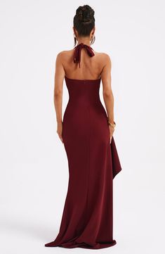 Wow them in the Luella maxi. A dress to make memories in. this halter style has a plunge neckline to frame the bust. with a flattering. body hugging fit. The look is complete with a thigh high split and ruffle detail. Pair yours with effortless waves and heeled mules.   Colour: Burgundy. Premium stretch crepe fabric. Cinches the waist and hugs the body. Plunge neckline. Halterneck. Ruffle detail. Thigh high split. Maxi length. Model is an XS and is wearing an XS. Homecoming Dresses Corset, Midi Dress Wedding Guest, Maxi Dress Summer, Deep V Dress, Maxi Dress Sale, Sleeveless Bodycon Dress, Sparkle Dress, Bodycon Maxi Dresses, Dresses By Length